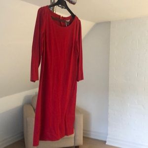 Red dress, three quarter length sleeve, gold zipper in the back. Gently used.
